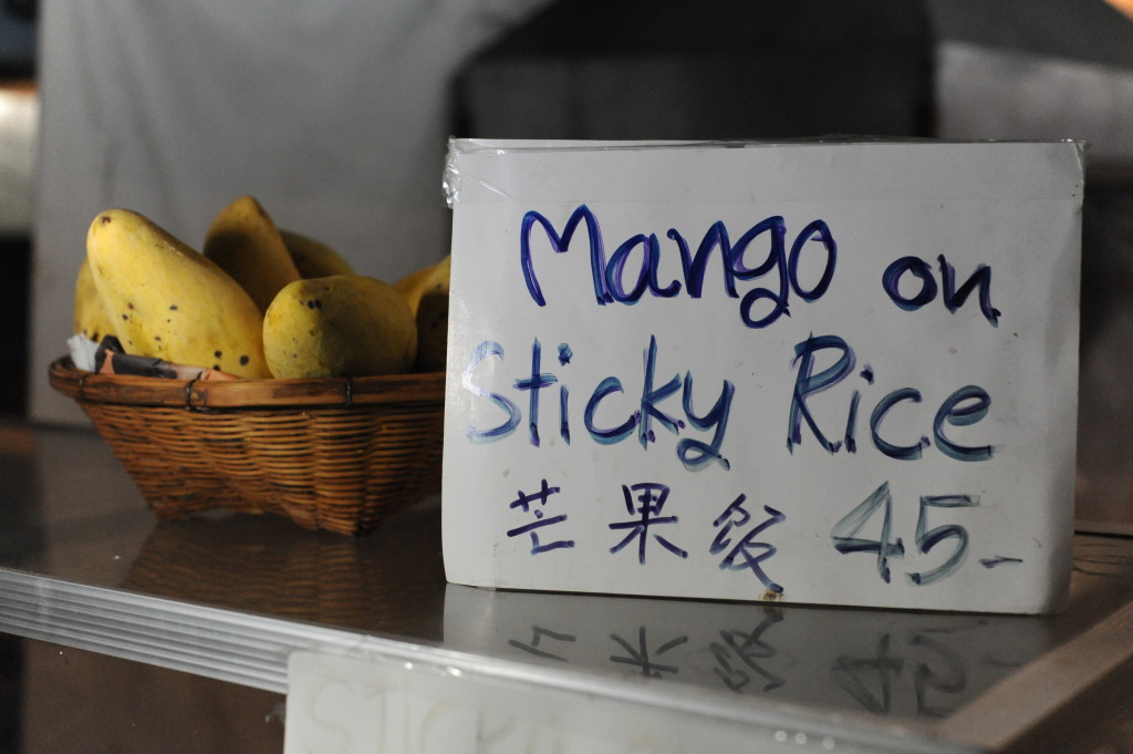 Eating mango sticky rice as much as possible in Thailand.